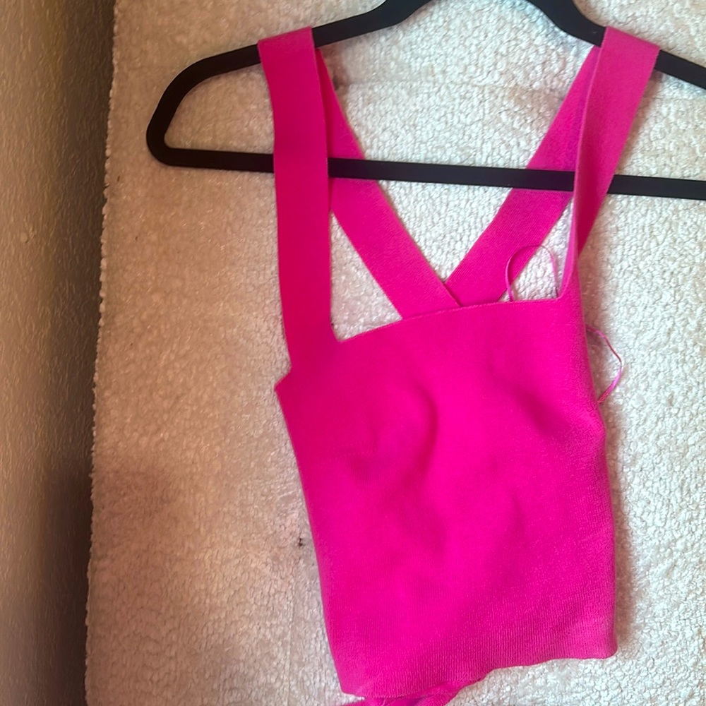 Pink knit tank top with bow cross cross tie in the back